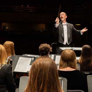 Photo: McCutcheon conducts the Wind Symphony